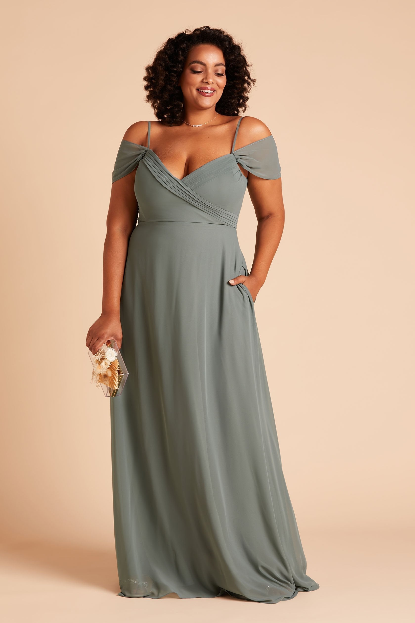 Spence convertible plus size bridesmaid dress in sea glass green chiffon by Birdy Grey, front view with hand in pocket