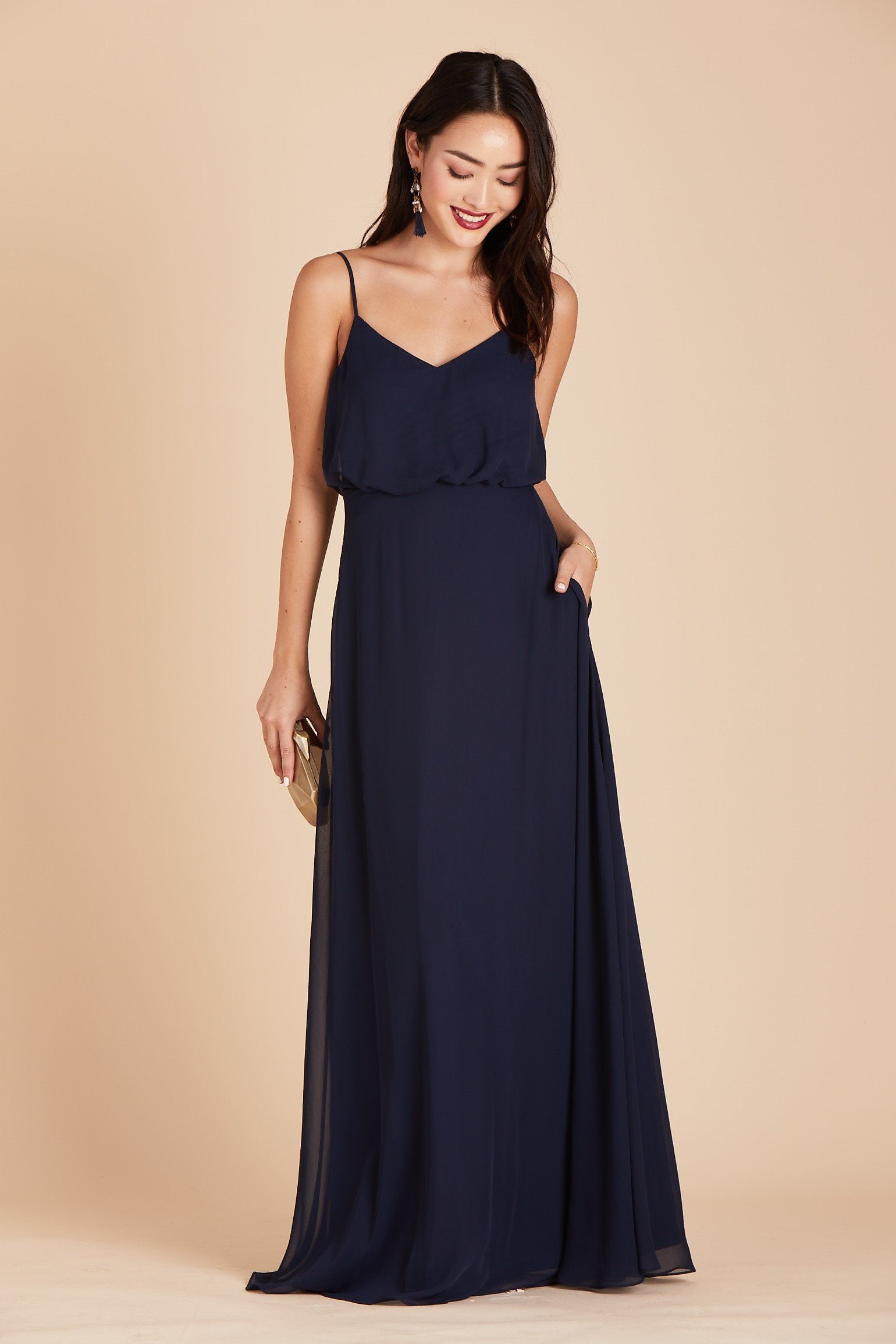 Gwennie bridesmaid dress in navy blue chiffon by Birdy Grey, front view with hand in pocket