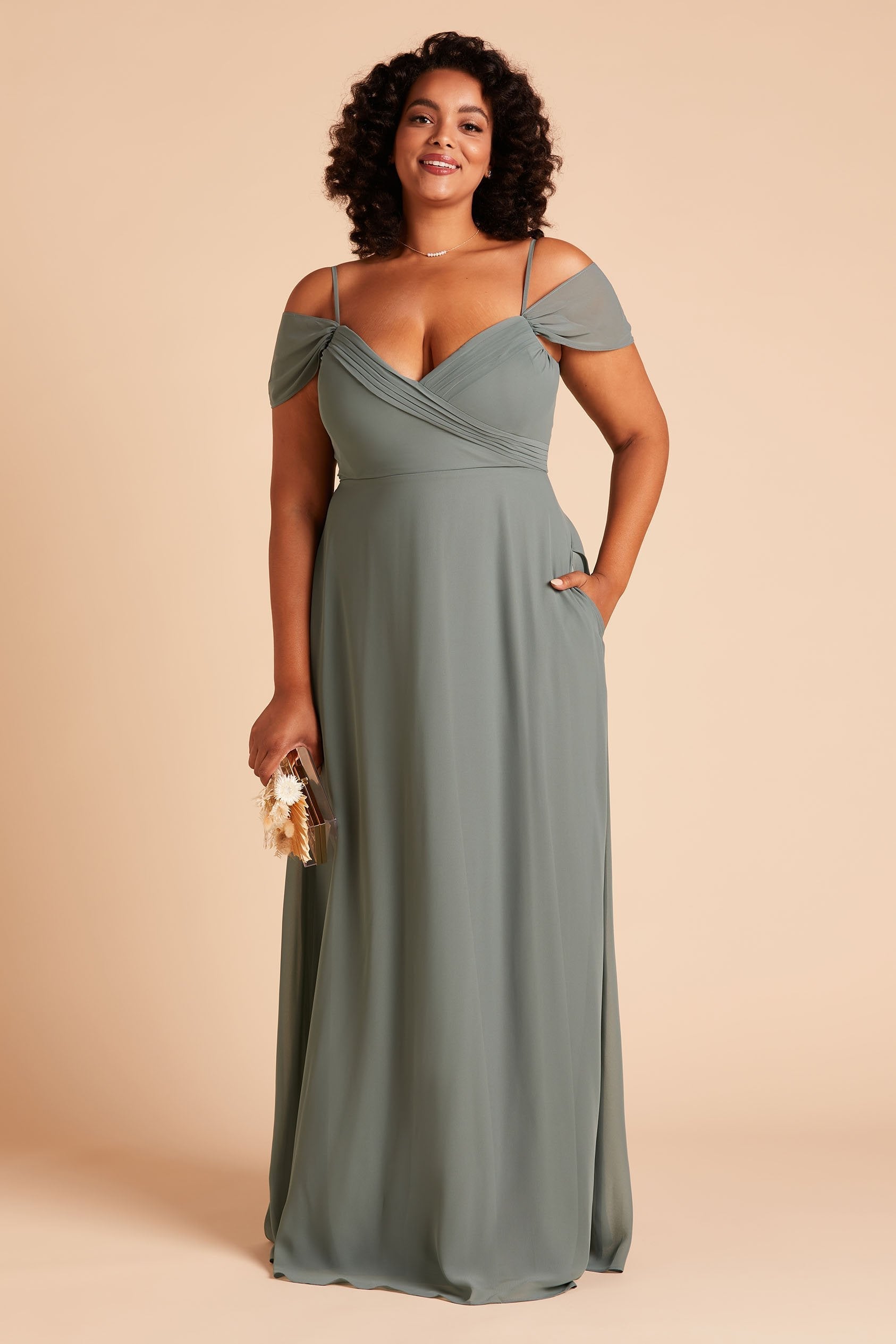 Spence convertible plus size bridesmaid dress in sea glass green chiffon by Birdy Grey, front view with hand in pocket