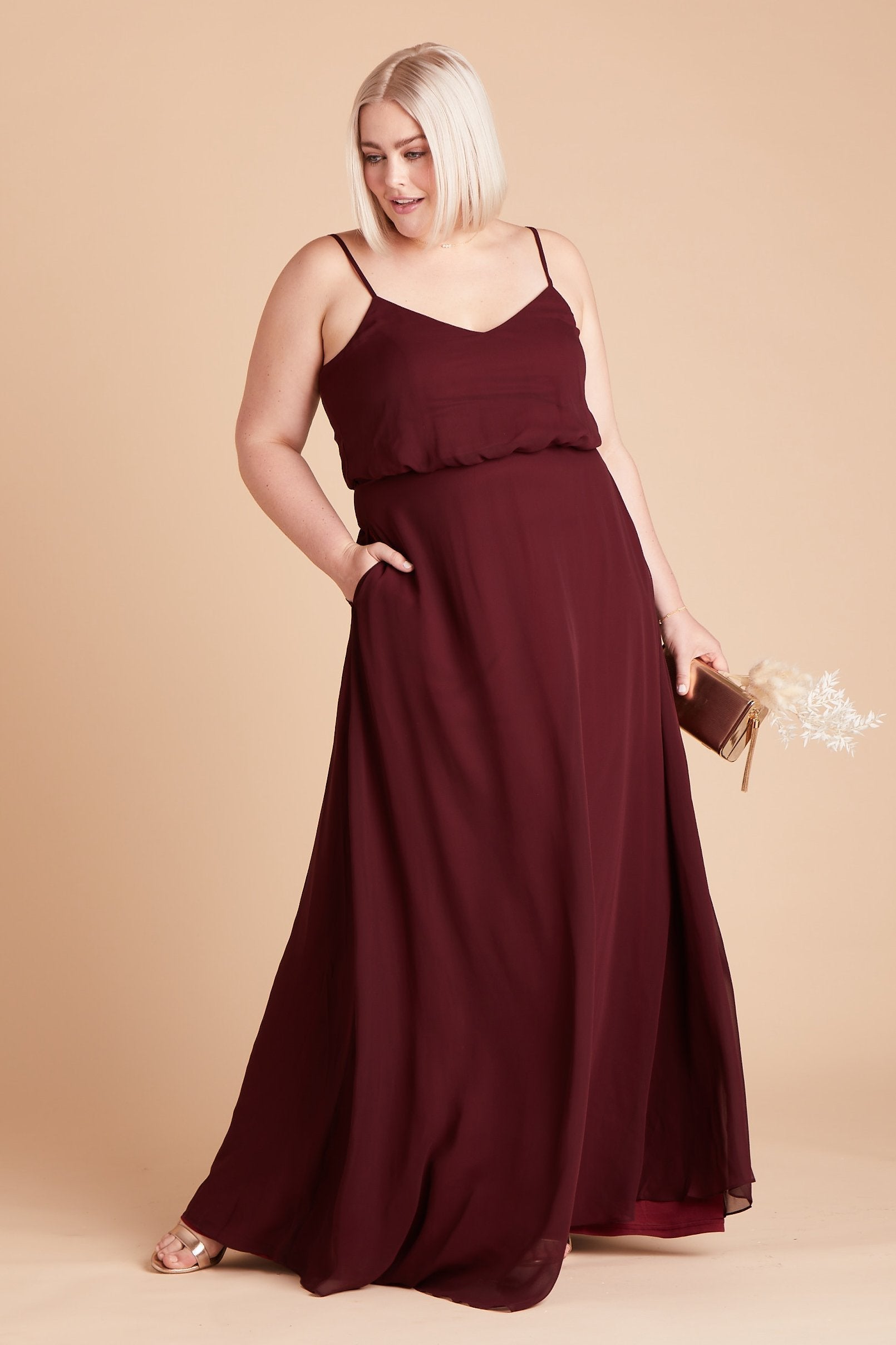 Gwennie plus size bridesmaid dress in cabernet burgundy chiffon by Birdy Grey, front view with hand in pocket