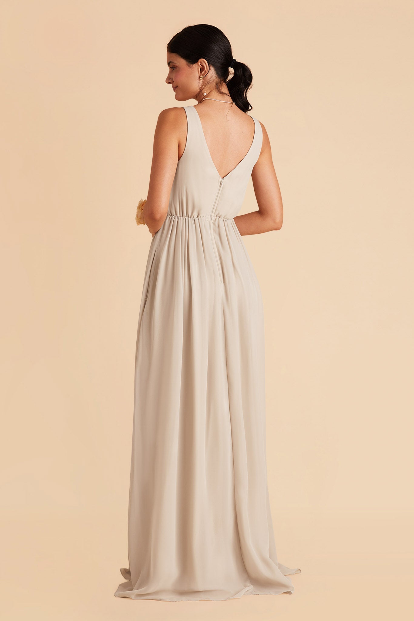 Laurie Empire maternity bridesmaid dress with slit in neutral champagne by Birdy Grey, back view