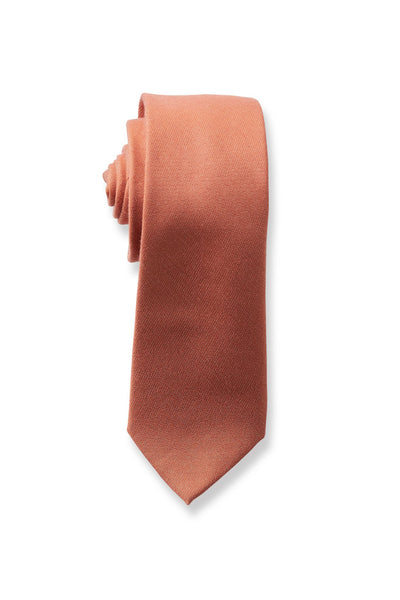 Front closeup view of the Simon Necktie in terracotta rolled up with the pointed necktie end extended showing the material texture and sheen.